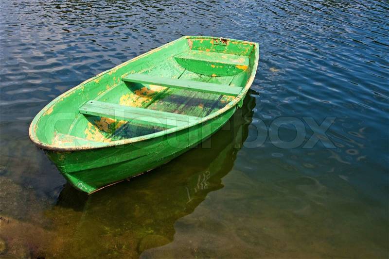 Old green rowing boat on a lake | Stock Photo | Colourbox