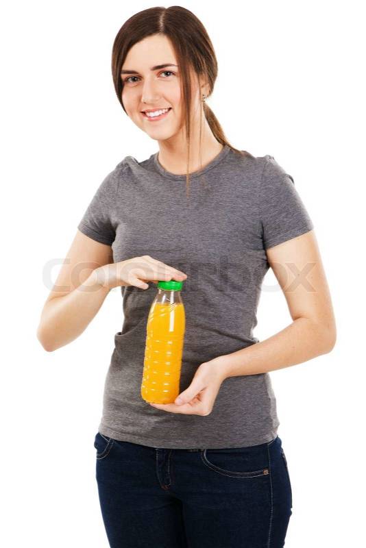 Young beautiful woman holding juice bottle, isolated on ...